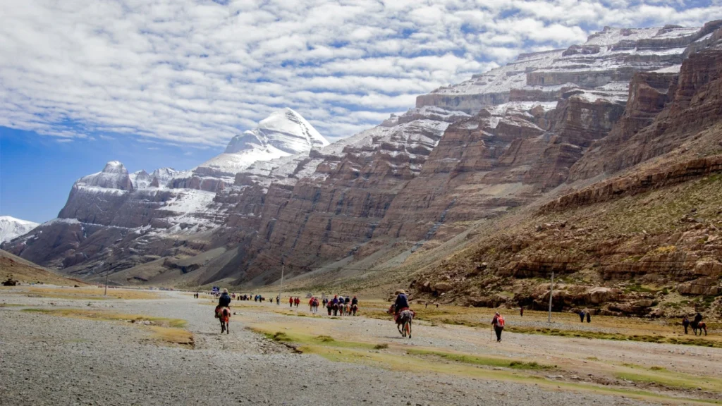 Pilgrims riding horses along the Mount Kailash Kora route.